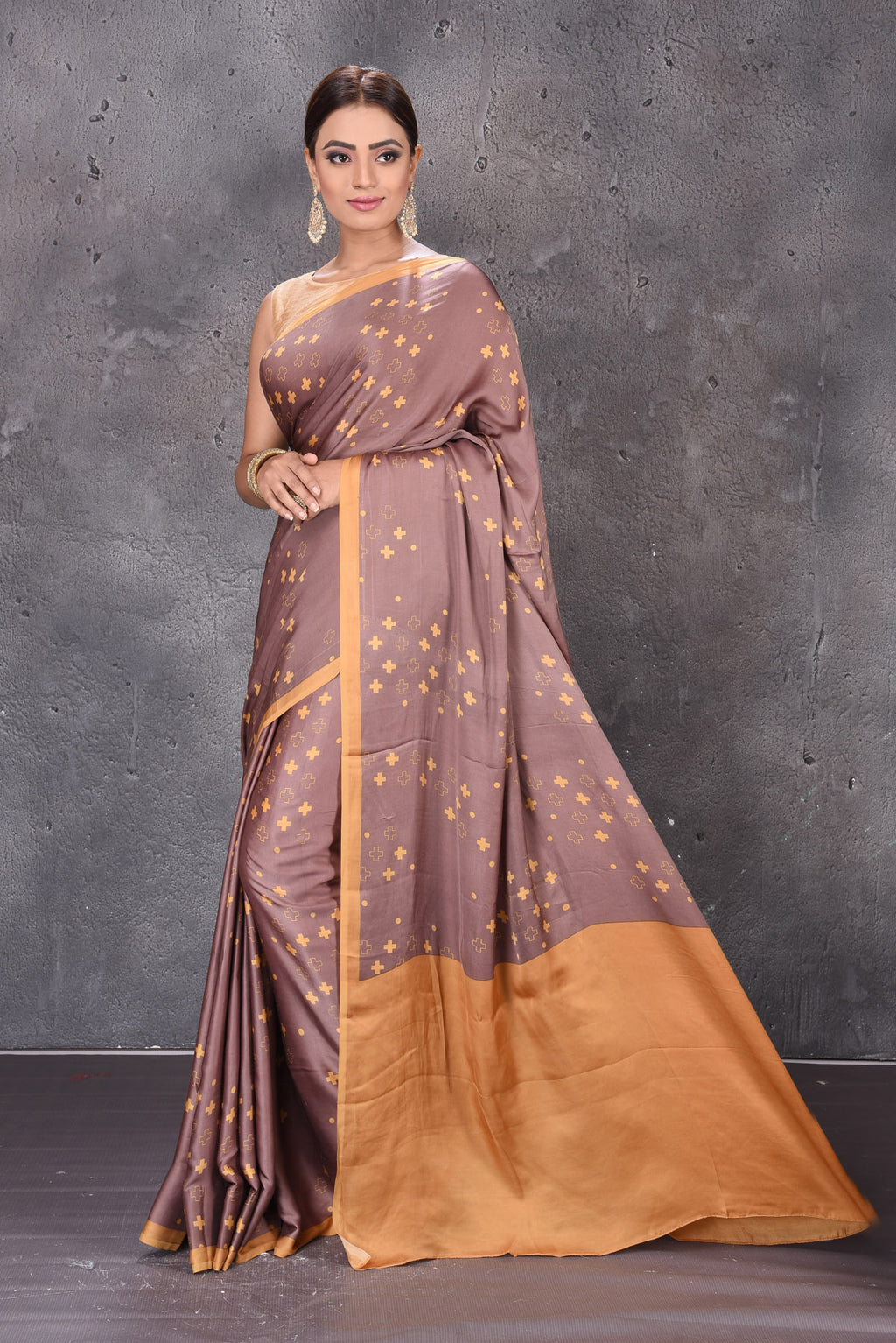 Buy elegant brown modal silk saree online in USA with printed overall buta. Keep your ethnic wardrobe up to date with latest designer sarees, pure silk sarees, handwoven sarees, tussar silk sarees, embroidered sarees from Pure Elegance Indian saree store in USA.-full view