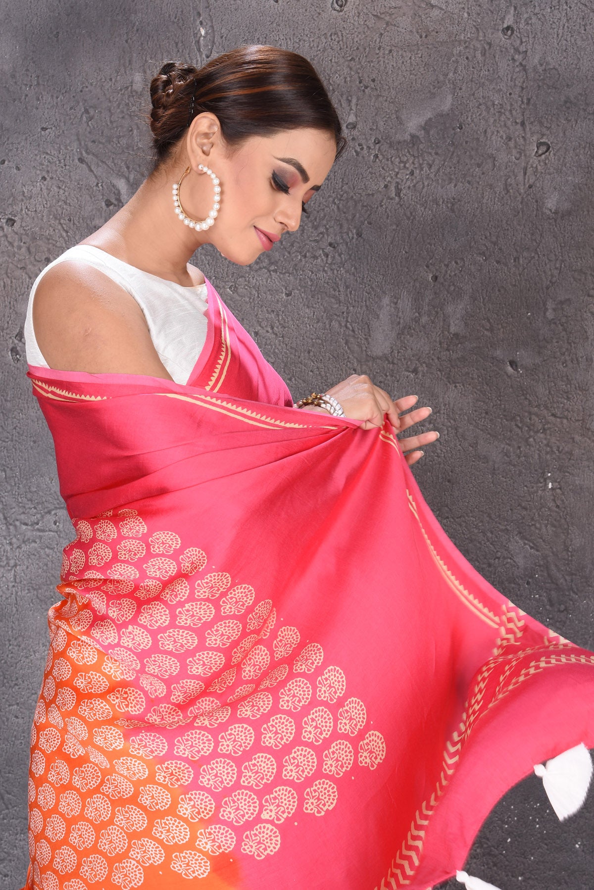 Shop gorgeous pink and orange modal silk saree online in USA. Keep your ethnic wardrobe up to date with latest designer sarees, pure silk sarees, handwoven sarees, tussar silk sarees, embroidered sarees from Pure Elegance Indian saree store in USA.-closeup