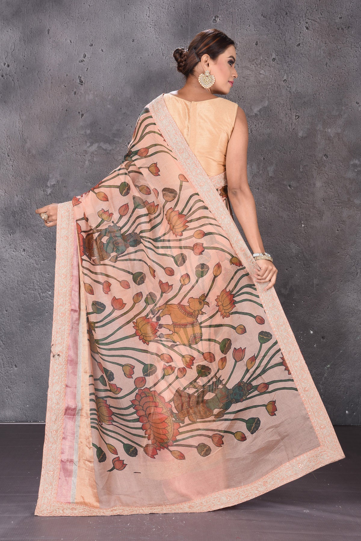 Shop stunning beige printed Kota silk sari online in USA with embroidered zari border. Keep your ethnic wardrobe up to date with latest designer sarees, pure silk sarees, handwoven sarees, tussar silk sarees, embroidered sarees from Pure Elegance Indian saree store in USA.-back