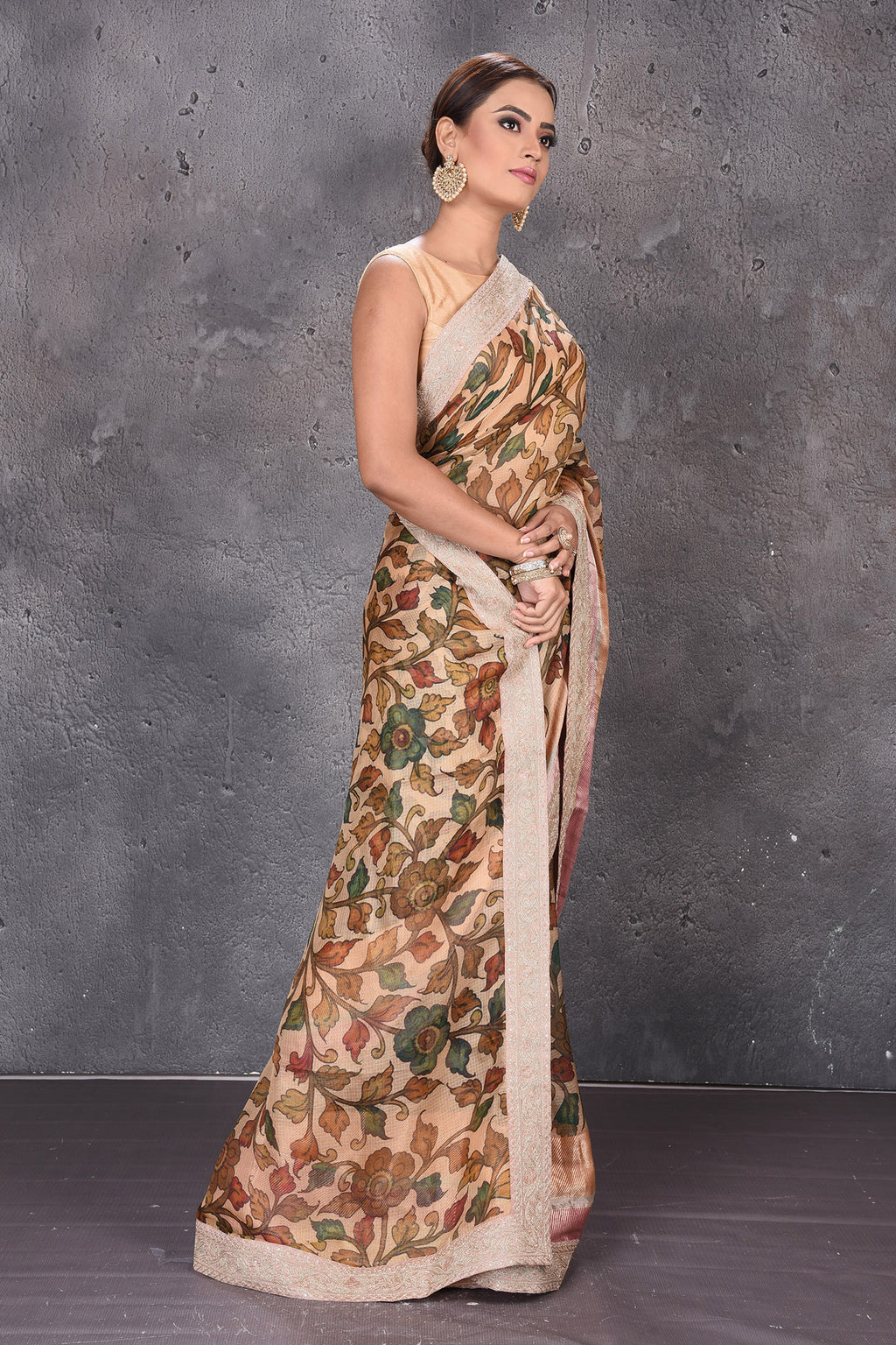 Buy elegant beige printed Kota silk saree online in USA with embroidered zari border. Keep your ethnic wardrobe up to date with latest designer sarees, pure silk sarees, handwoven sarees, tussar silk sarees, embroidered saris from Pure Elegance Indian saree store in USA.-side