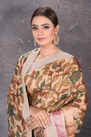 Buy elegant beige printed Kota silk saree online in USA with embroidered zari border. Keep your ethnic wardrobe up to date with latest designer sarees, pure silk sarees, handwoven sarees, tussar silk sarees, embroidered saris from Pure Elegance Indian saree store in USA.-closeup