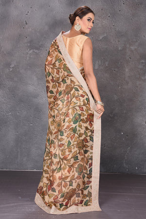 Buy elegant beige printed Kota silk saree online in USA with embroidered zari border. Keep your ethnic wardrobe up to date with latest designer sarees, pure silk sarees, handwoven sarees, tussar silk sarees, embroidered saris from Pure Elegance Indian saree store in USA.-back