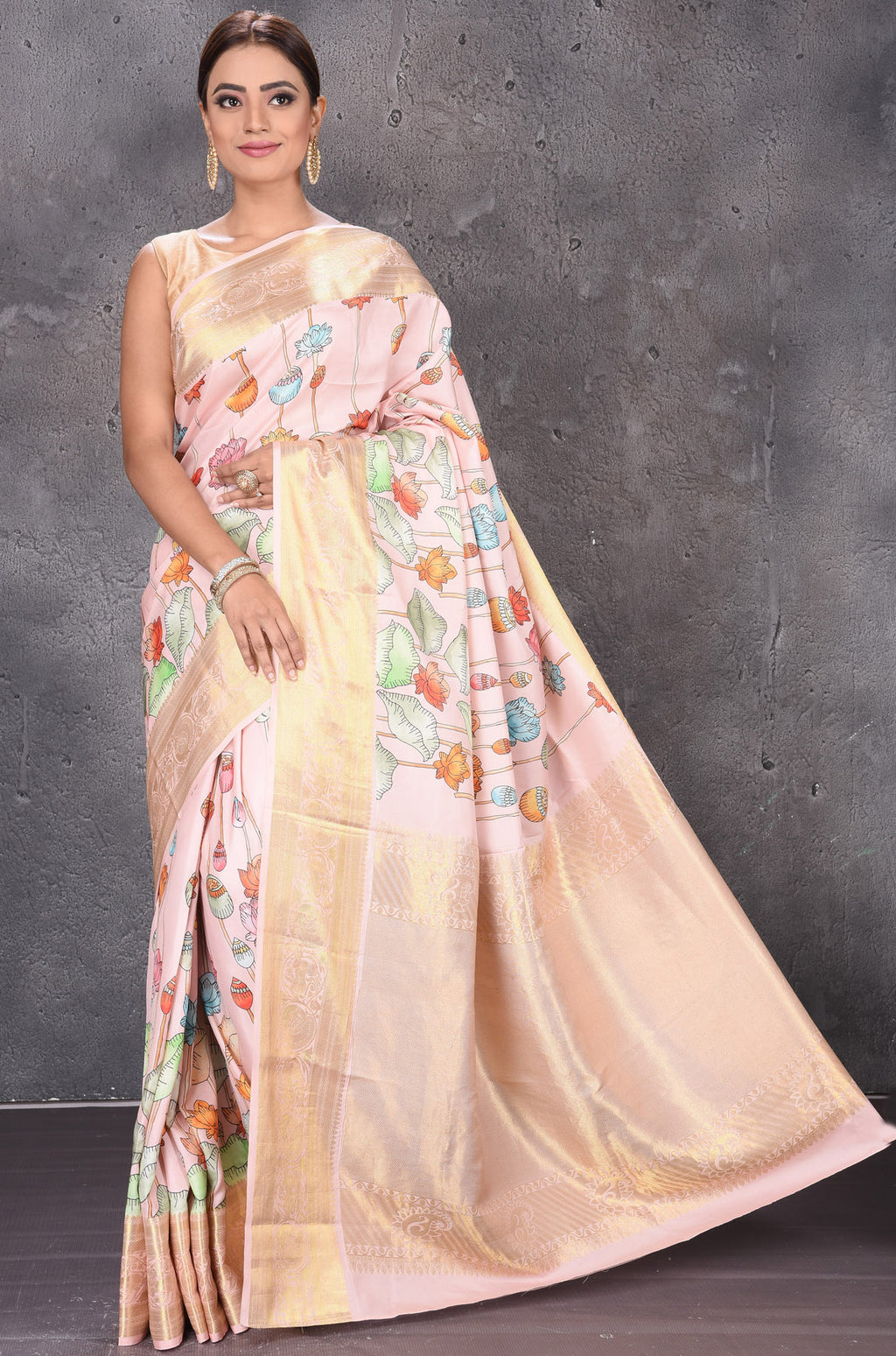 Buy powder pink printed Kanjeevaram silk saree online in USA with zari border. Keep your ethnic wardrobe up to date with latest designer sarees, pure silk sarees, handwoven sarees, tussar silk sarees, embroidered sarees from Pure Elegance Indian saree store in USA.-full view