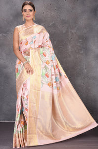 Buy powder pink printed Kanjeevaram silk saree online in USA with zari border. Keep your ethnic wardrobe up to date with latest designer sarees, pure silk sarees, handwoven sarees, tussar silk sarees, embroidered sarees from Pure Elegance Indian saree store in USA.-full view