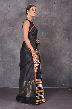 Shop stunning black Mashru silk saree online in USA with striped border. Keep your ethnic wardrobe up to date with latest designer sarees, pure silk sarees, handwoven sarees, tussar silk sarees, embroidered sarees from Pure Elegance Indian saree store in USA.-side