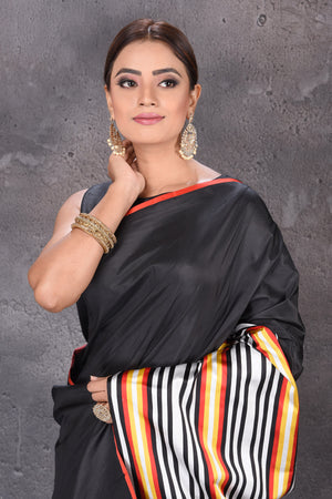Shop stunning black Mashru silk saree online in USA with striped border. Keep your ethnic wardrobe up to date with latest designer sarees, pure silk sarees, handwoven sarees, tussar silk sarees, embroidered sarees from Pure Elegance Indian saree store in USA.-closeup