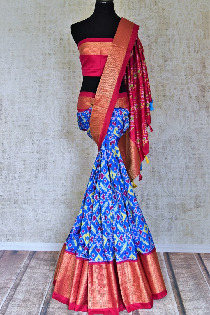Buy stunning turquoise blue Pochampally ikkat saree online in USA with pink zari border. Flaunt your sartorial choices on special occasions in stunning designer sarees, embroidered sarees, handloom sarees, Banarasi sarees, crepe sarees from Pure Elegance Indian fashion store in USA.-full view