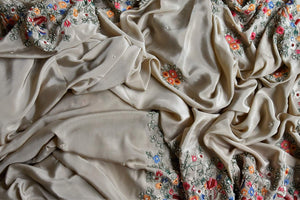 Buy beautiful beige floral crepe silk sari online in USA with hand embroidered border. Flaunt your sartorial choices on special occasions in stunning designer sarees, embroidered sarees, handloom sarees, Banarasi sarees, crepe sarees from Pure Elegance Indian fashion store in USA.-details