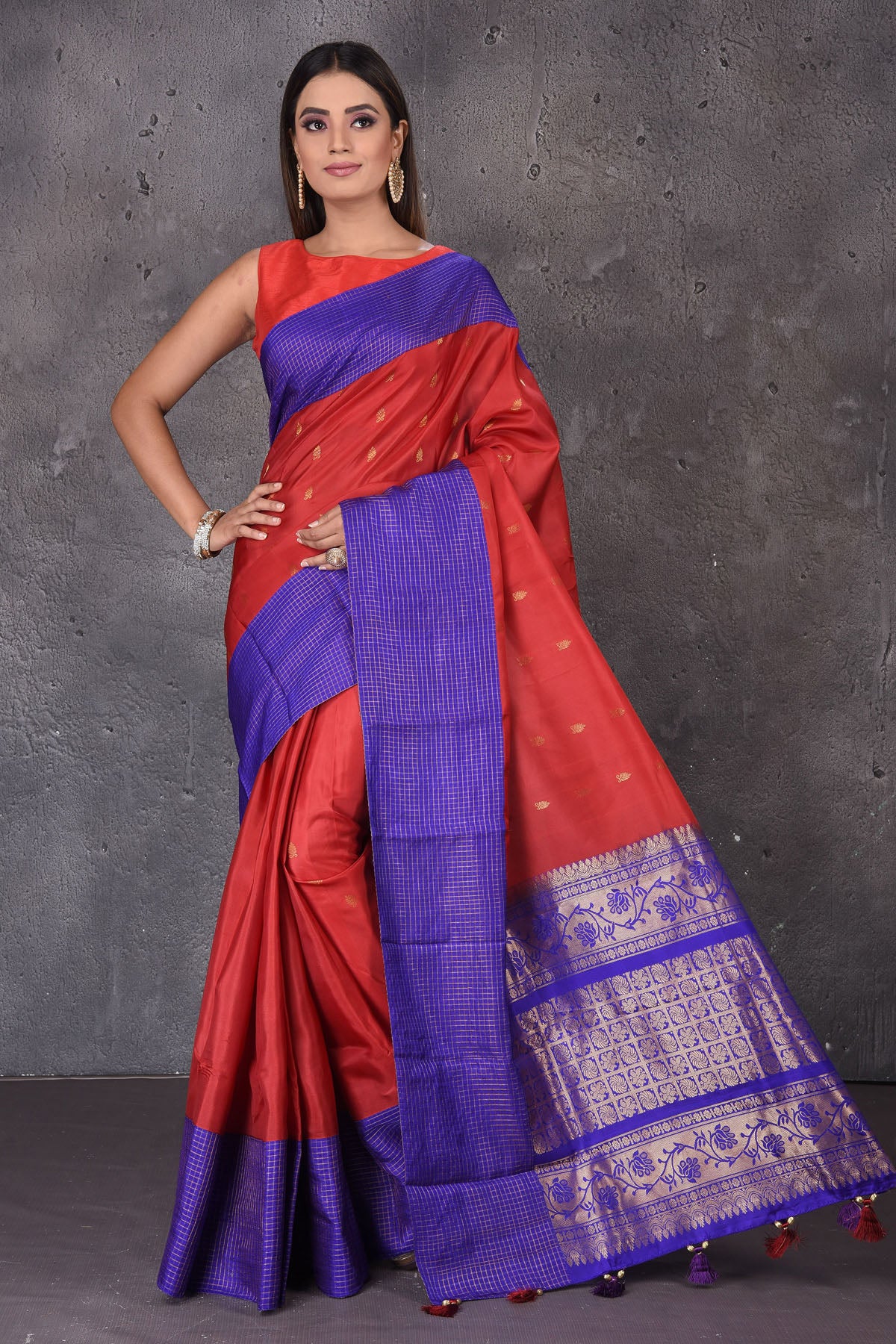Buy stunning red Gadhwal silk saree online in USA with blue border and buta. Enrich your ethnic wardrobe with traditional Indian sarees, designer sarees. embroidered sarees, pure silk sarees, handwoven sarees, Kanchipuram sarees, Banarasi saris from Pure Elegance Indian saree store in USA.-full view