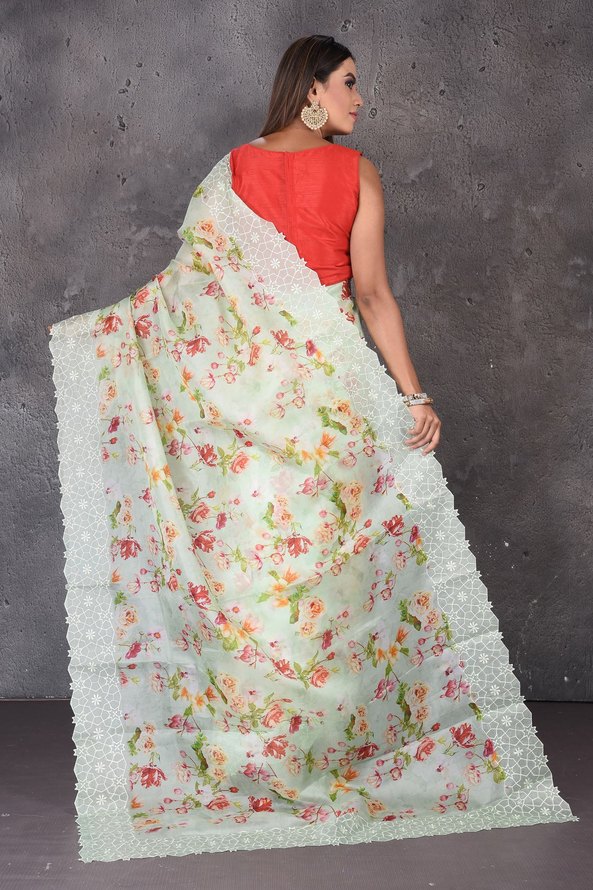 Shop beautiful mint green floral organza sari online in USA with embroidered border. Enrich your ethnic wardrobe with traditional Indian sarees, designer sarees. embroidered sarees, pure silk sarees, handwoven sarees, Kanchipuram sarees, Banarasi saris from Pure Elegance Indian saree store in USA.-back