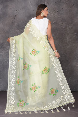 Shop stunning pastel green floral organza sari online in USA with embroidered border. Enrich your ethnic wardrobe with traditional Indian sarees, designer sarees. embroidered sarees, pure silk sarees, handwoven sarees, Kanchipuram sarees, Banarasi saris from Pure Elegance Indian saree store in USA.-back