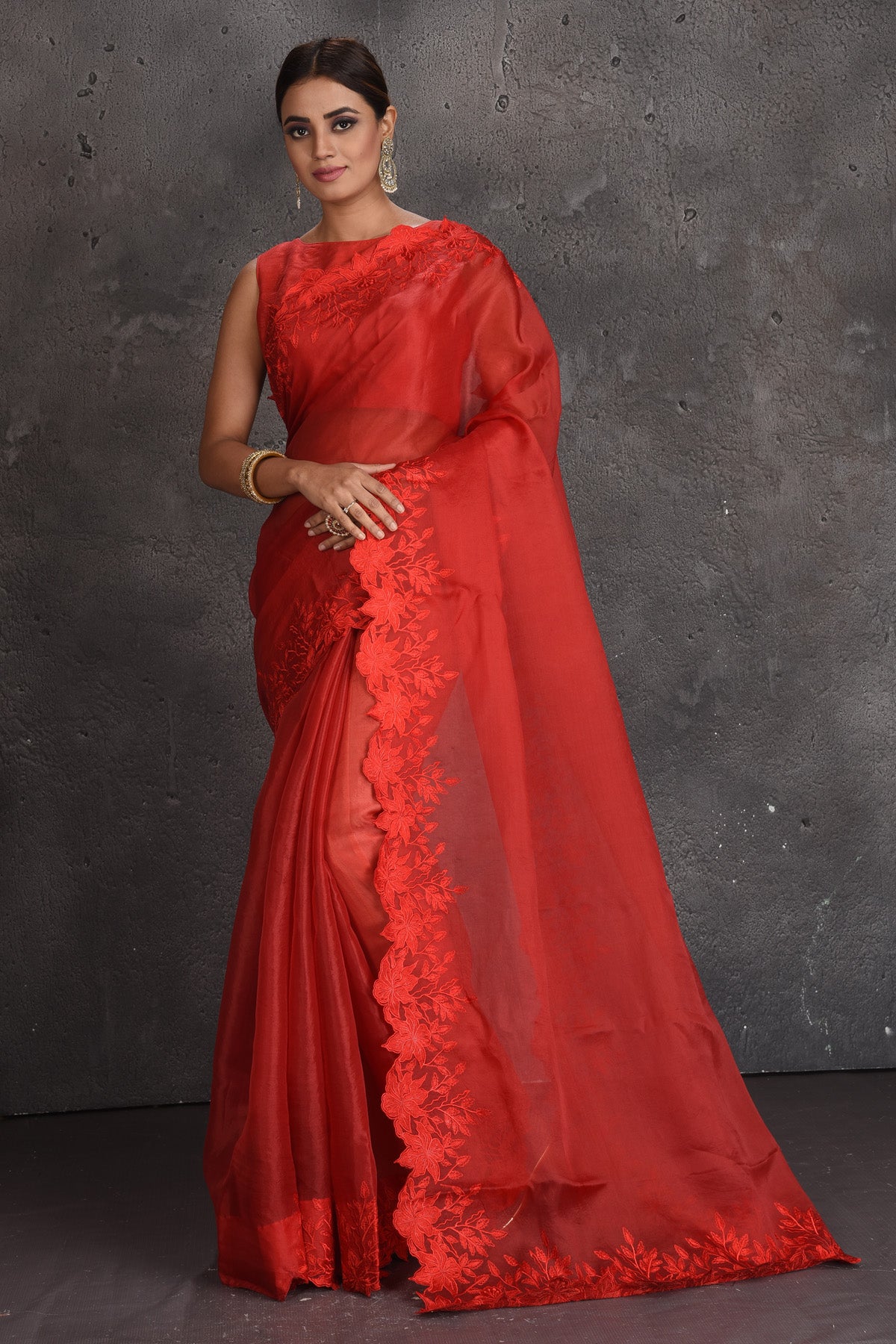 Shop beautiful red organza saree online in USA with floral cut-work border. Keep your ethnic wardrobe up to date with latest designer sarees, pure silk sarees, handwoven sarees, tussar silk sarees, embroidered sarees, organza saris from Pure Elegance Indian fashion store in USA.-full view