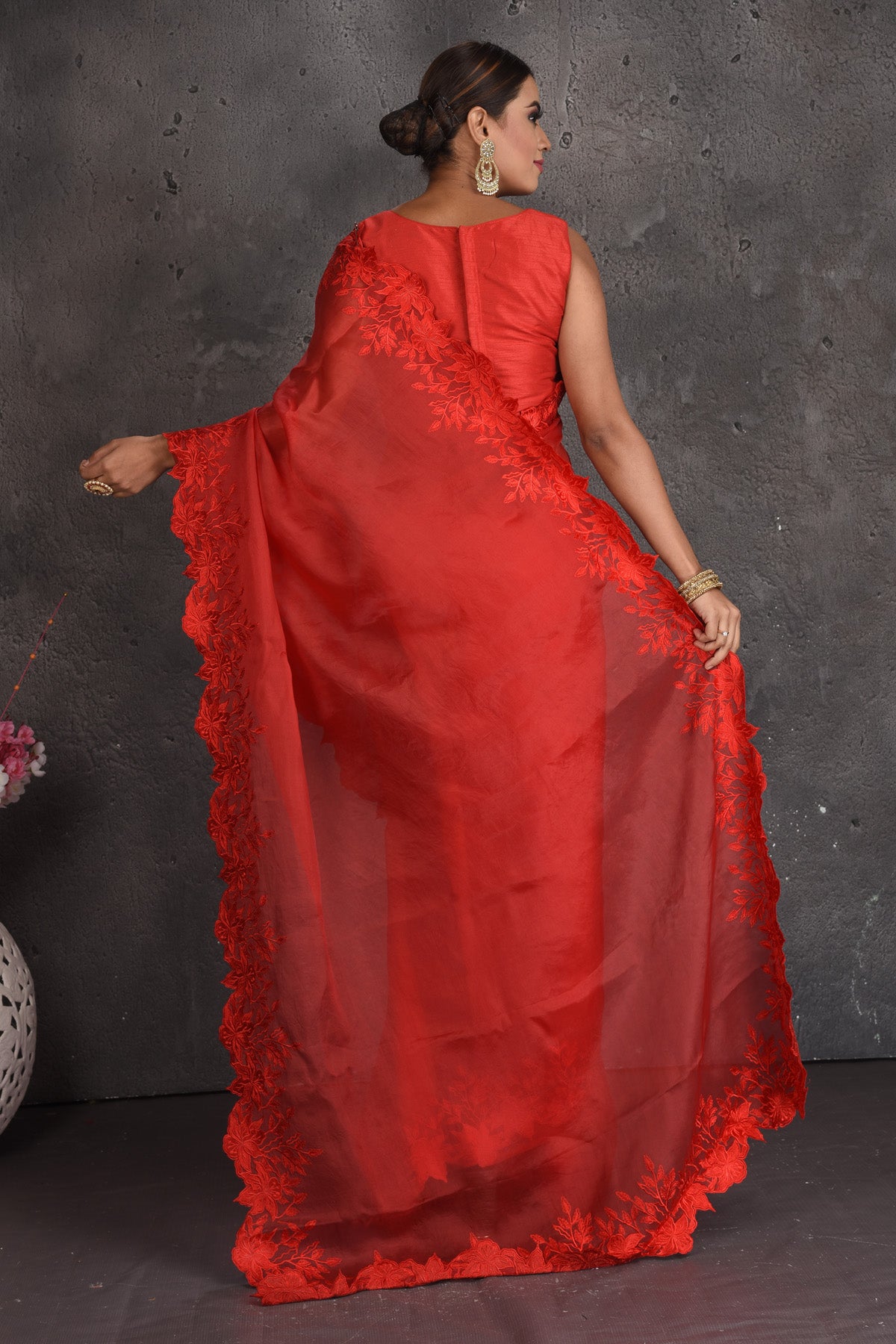 Shop beautiful red organza saree online in USA with floral cut-work border. Keep your ethnic wardrobe up to date with latest designer sarees, pure silk sarees, handwoven sarees, tussar silk sarees, embroidered sarees, organza saris from Pure Elegance Indian fashion store in USA.-back