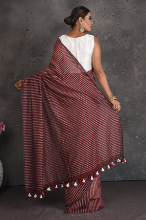 Buy stunning maroon striped handloom cotton saree online in USA. Keep your ethnic wardrobe up to date with latest designer sarees, pure silk sarees, handwoven sarees, tussar silk sarees, embroidered sarees, organza saris from Pure Elegance Indian fashion store in USA.-back