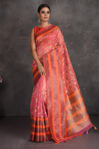 Shop beautiful pink fancy Kora saree online in USA with golden zari orange border. Keep your ethnic wardrobe up to date with latest designer sarees, pure silk sarees, handwoven sarees, tussar silk sarees, embroidered sarees, organza saris from Pure Elegance Indian fashion store in USA.-full view