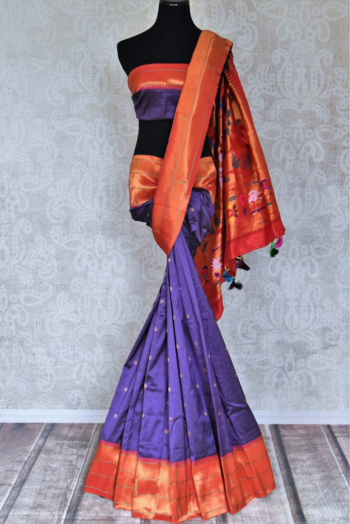 Buy stunning blue handloom silk Paithani saree online in USA with red zari border. Flaunt your sartorial choices on special occasions in stunning designer sarees, embroidered sarees, handloom sarees, Banarasi sarees, crepe sarees from Pure Elegance Indian fashion store in USA.-full view