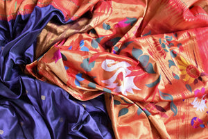 Buy stunning blue handloom silk Paithani saree online in USA with red zari border. Flaunt your sartorial choices on special occasions in stunning designer sarees, embroidered sarees, handloom sarees, Banarasi sarees, crepe sarees from Pure Elegance Indian fashion store in USA.-details