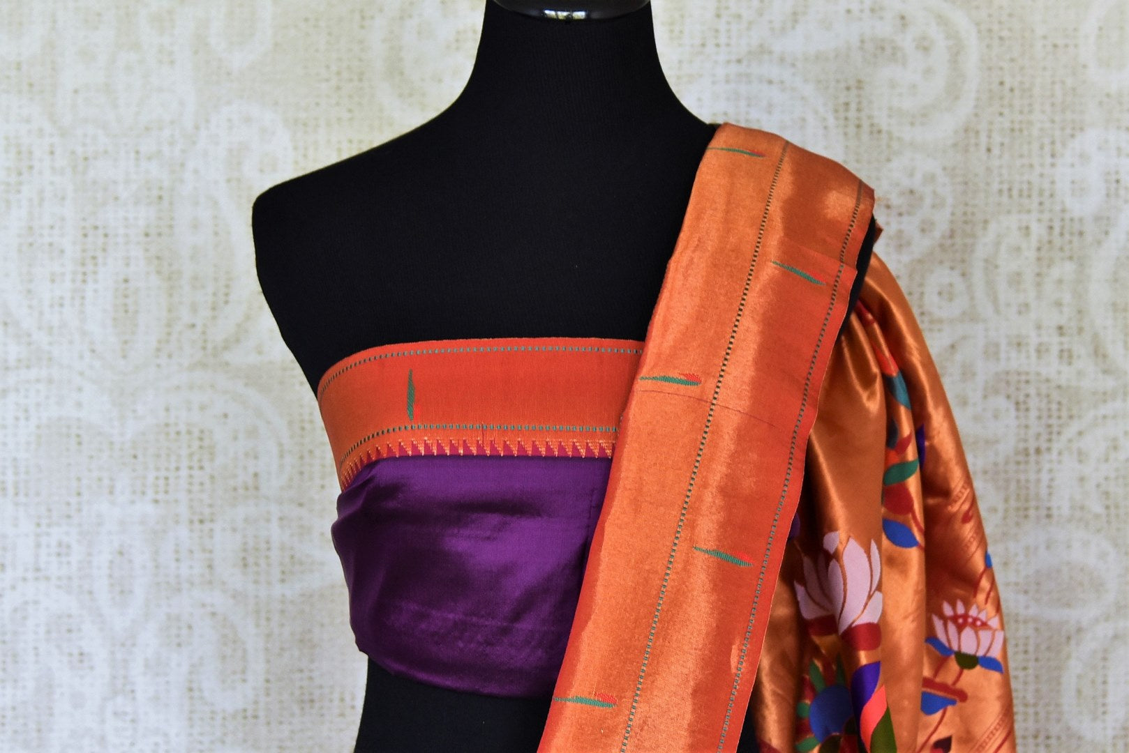 Buy stunning purple off-white handloom silk Paithani saree online in USA with red zari border. Flaunt your sartorial choices on special occasions in stunning designer sarees, embroidered sarees, handloom sarees, Banarasi sarees, crepe sarees from Pure Elegance Indian fashion store in USA.-blouse pallu