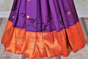 Buy stunning purple off-white handloom silk Paithani saree online in USA with red zari border. Flaunt your sartorial choices on special occasions in stunning designer sarees, embroidered sarees, handloom sarees, Banarasi sarees, crepe sarees from Pure Elegance Indian fashion store in USA.-pleats