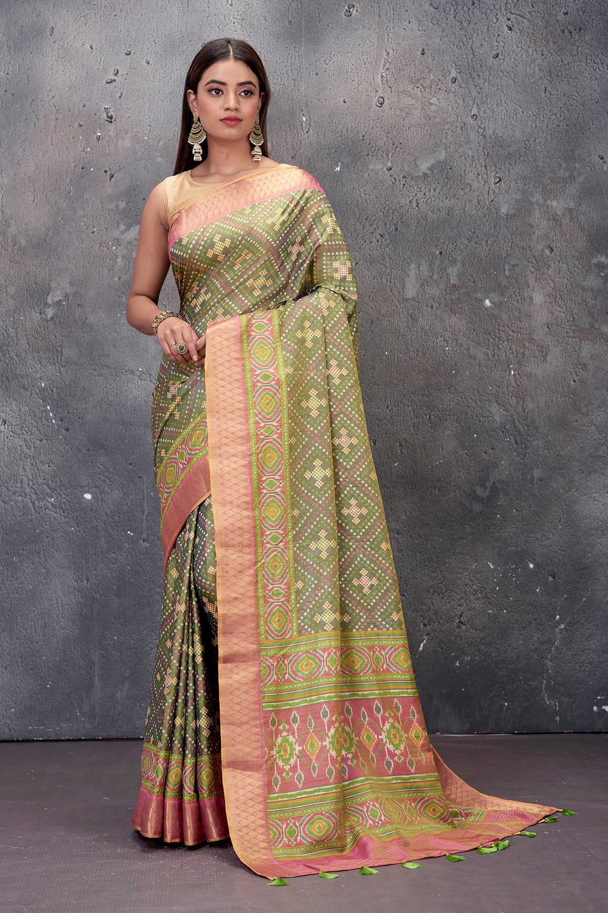 Buy stunning sage green fancy Patola saree online in USA with pink zari border. Keep your ethnic wardrobe up to date with latest designer saris, pure silk sarees, handwoven sarees, tussar silk sarees, embroidered saris from Pure Elegance Indian saree store in USA.-full view