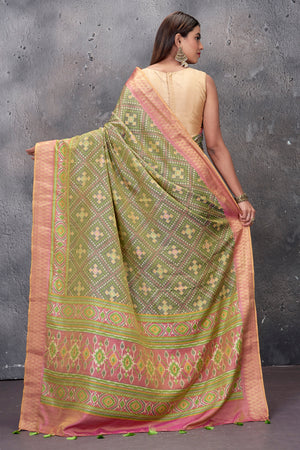 Buy stunning sage green fancy Patola saree online in USA with pink zari border. Keep your ethnic wardrobe up to date with latest designer saris, pure silk sarees, handwoven sarees, tussar silk sarees, embroidered saris from Pure Elegance Indian saree store in USA.-back