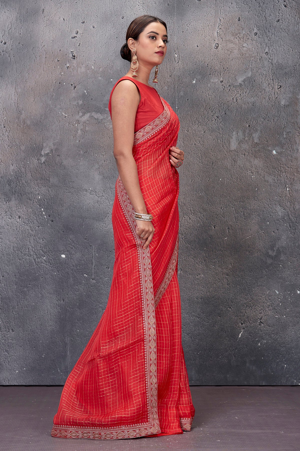 Shop beautiful red designer saree online in USA with embroidered border and saree blouse. Keep your ethnic wardrobe up to date with latest designer saris, pure silk sarees, handwoven sarees, tussar silk sarees, embroidered saris from Pure Elegance Indian saree store in USA.-side