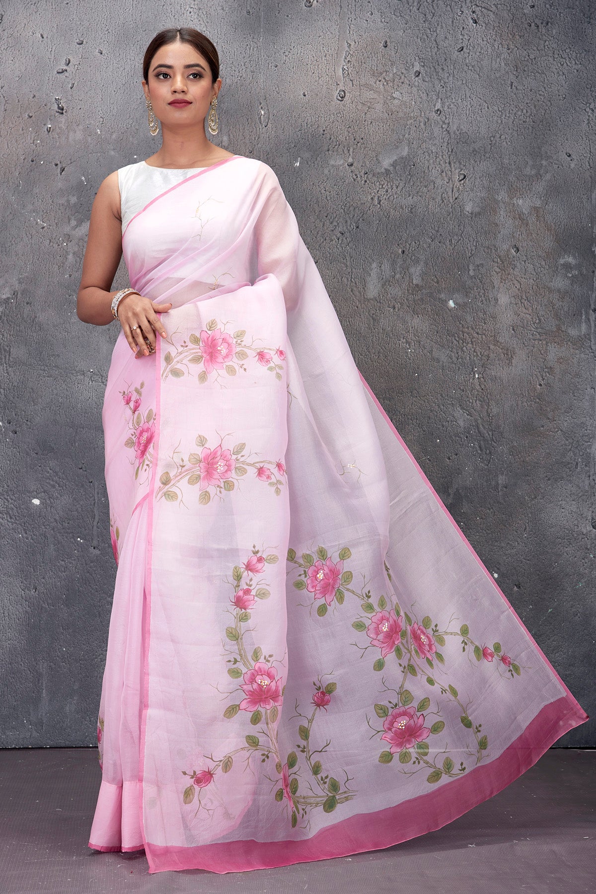 Shop stunning powder pink hand painted organza saree online in USA. Keep your ethnic wardrobe up to date with latest designer saris, pure silk sarees, handwoven sarees, tussar silk sarees, embroidered saris from Pure Elegance Indian saree store in USA.-full view