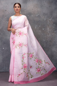 Shop stunning powder pink hand painted organza saree online in USA. Keep your ethnic wardrobe up to date with latest designer saris, pure silk sarees, handwoven sarees, tussar silk sarees, embroidered saris from Pure Elegance Indian saree store in USA.-full view
