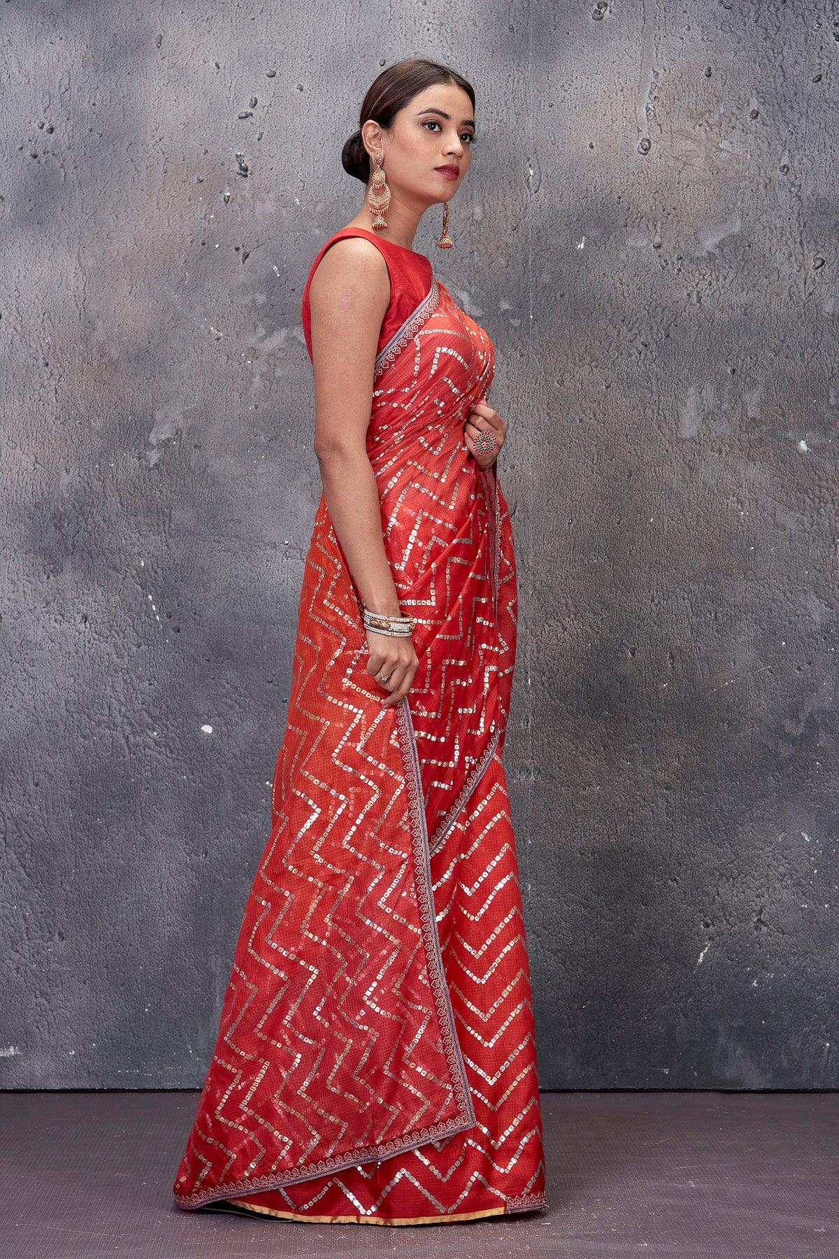 Shop stunning red chevron foil print Kota saree online in USA. Keep your ethnic wardrobe up to date with latest designer saris, pure silk sarees, handwoven sarees, tussar silk sarees, embroidered saris from Pure Elegance Indian saree store in USA.-side