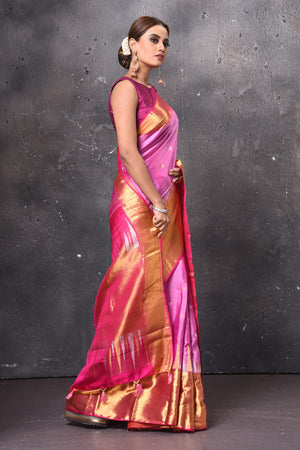 Buy stunning pink handloom Kanjivaram saree online in USA with golden zari border. Keep your ethnic wardrobe up to date with latest designer sarees, pure silk sarees, handwoven sarees, tussar silk sarees, embroidered sarees, chiffon saris from Pure Elegance Indian saree store in USA.-side