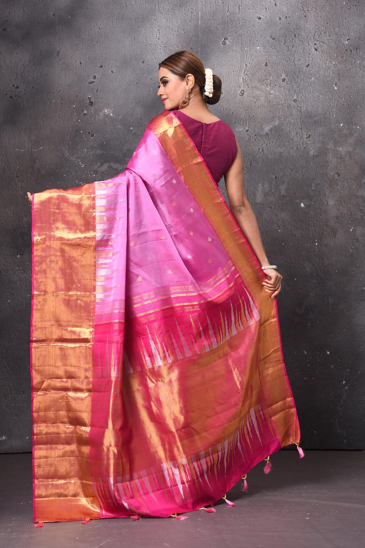 Buy stunning pink handloom Kanjivaram saree online in USA with golden zari border. Keep your ethnic wardrobe up to date with latest designer sarees, pure silk sarees, handwoven sarees, tussar silk sarees, embroidered sarees, chiffon saris from Pure Elegance Indian saree store in USA.-back