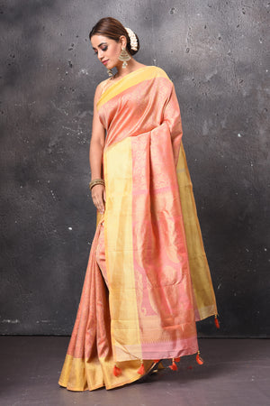 Buy gorgeous peach handloom Kanjivaram sari online in USA with yellow zari border. Keep your ethnic wardrobe up to date with latest designer sarees, pure silk sarees, handwoven sarees, tussar silk sarees, embroidered sarees, chiffon saris from Pure Elegance Indian saree store in USA.-side