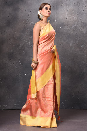 Buy gorgeous peach handloom Kanjivaram sari online in USA with yellow zari border. Keep your ethnic wardrobe up to date with latest designer sarees, pure silk sarees, handwoven sarees, tussar silk sarees, embroidered sarees, chiffon saris from Pure Elegance Indian saree store in USA.-right