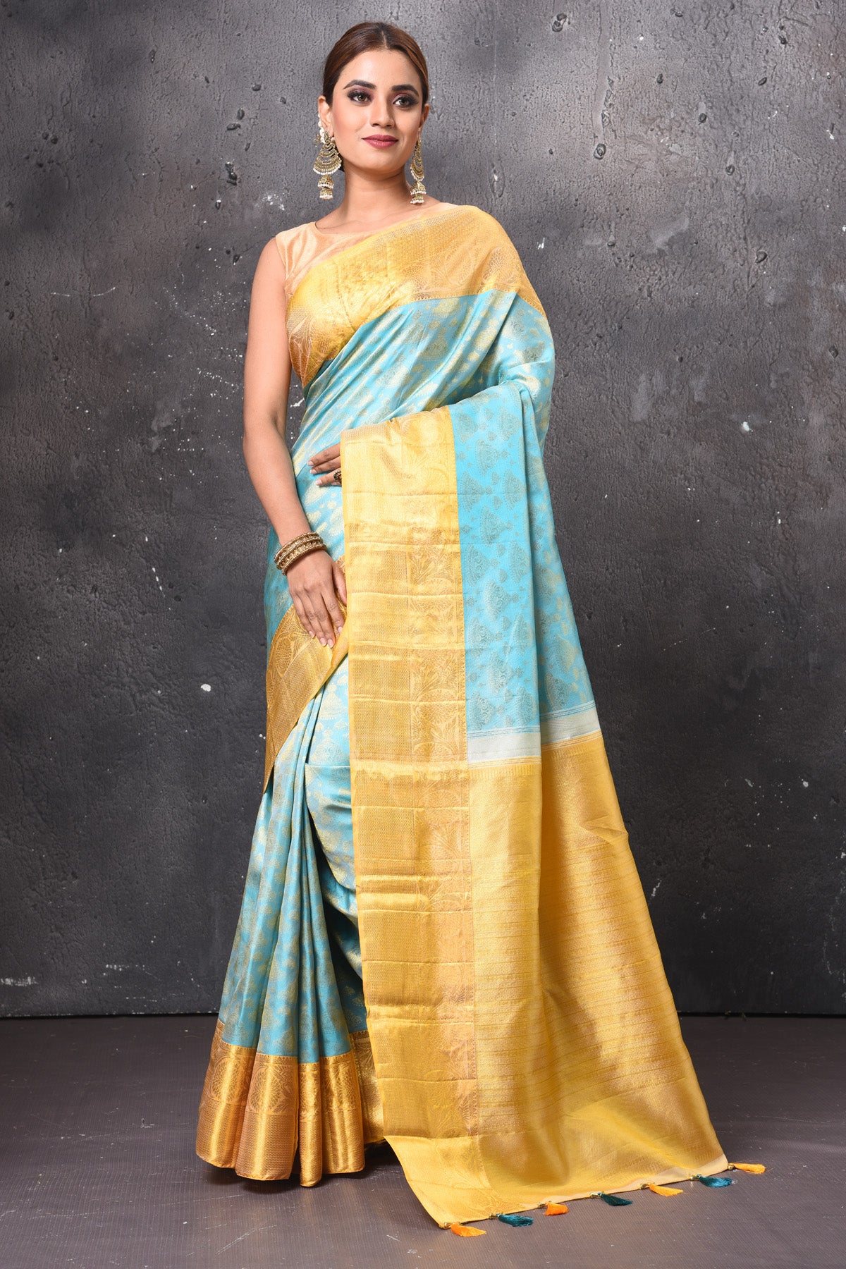Buy stunning pastel blue handloom Kanjivaram sari online in USA with yellow zari border. Keep your ethnic wardrobe up to date with latest designer sarees, pure silk sarees, handwoven sarees, tussar silk sarees, embroidered sarees, chiffon saris from Pure Elegance Indian saree store in USA.-full view