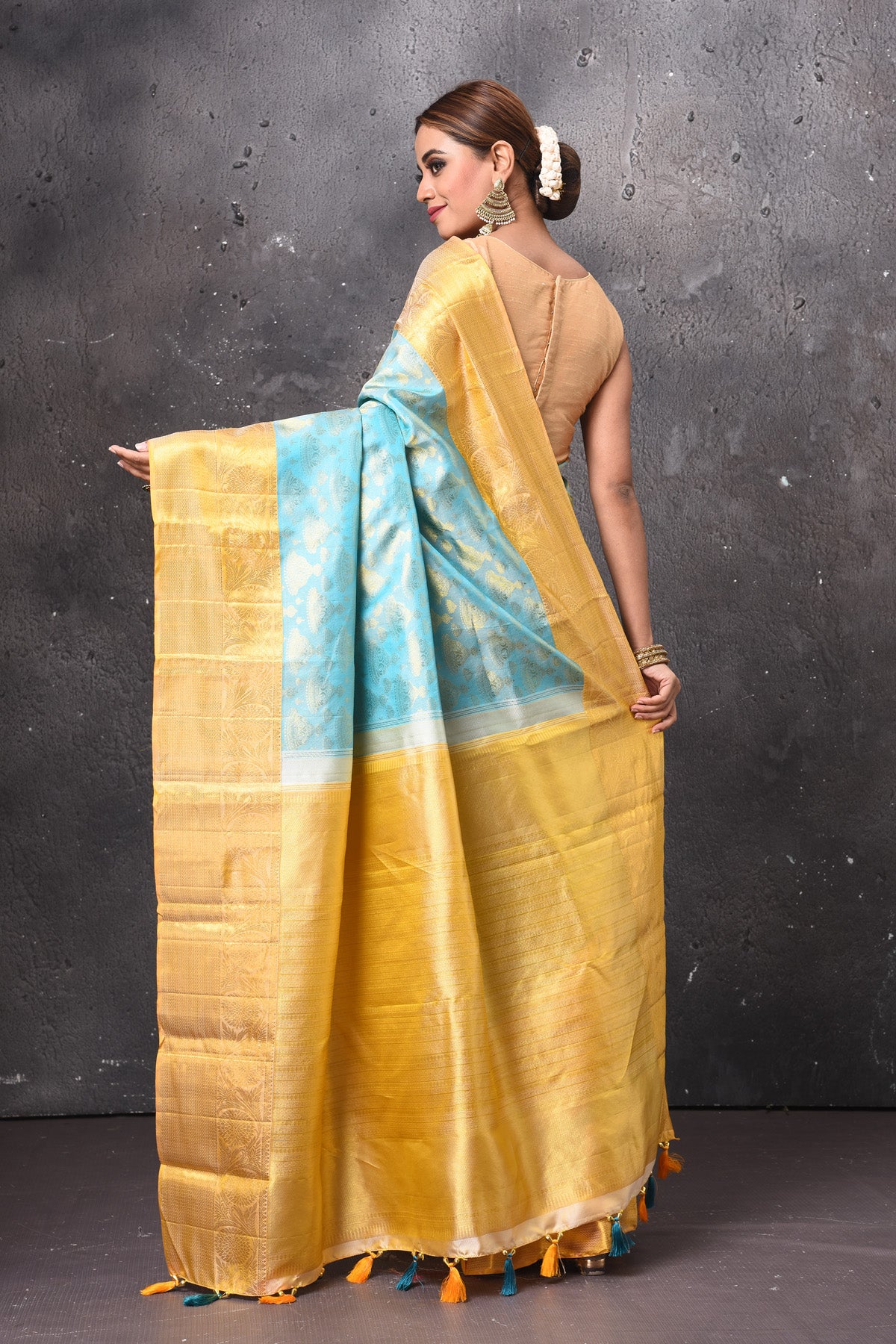 Buy stunning pastel blue handloom Kanjivaram sari online in USA with yellow zari border. Keep your ethnic wardrobe up to date with latest designer sarees, pure silk sarees, handwoven sarees, tussar silk sarees, embroidered sarees, chiffon saris from Pure Elegance Indian saree store in USA.-back
