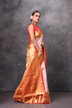 Buy gorgeous light pink handloom Kanjivaram sari online in USA with red zari border. Keep your ethnic wardrobe up to date with latest designer sarees, pure silk sarees, handwoven sarees, tussar silk sarees, embroidered sarees, chiffon saris from Pure Elegance Indian saree store in USA.-side