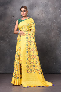 Buy beautiful yellow printed Patola saree online in USA. Keep your ethnic wardrobe up to date with latest designer sarees, pure silk sarees, handwoven sarees, tussar silk sarees, embroidered sarees, chiffon saris from Pure Elegance Indian saree store in USA.-full view