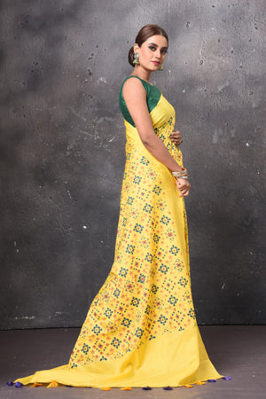 Buy beautiful yellow printed Patola saree online in USA. Keep your ethnic wardrobe up to date with latest designer sarees, pure silk sarees, handwoven sarees, tussar silk sarees, embroidered sarees, chiffon saris from Pure Elegance Indian saree store in USA.-side