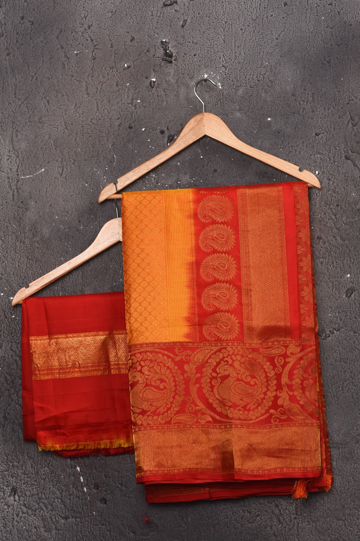 Buy stunning orange Gadwal check sari online in USA with red zari border. Keep your ethnic wardrobe up to date with latest designer sarees, pure silk sarees, handwoven sarees, tussar silk sarees, embroidered sarees, Banarasi saris from Pure Elegance Indian saree store in USA.-blouse