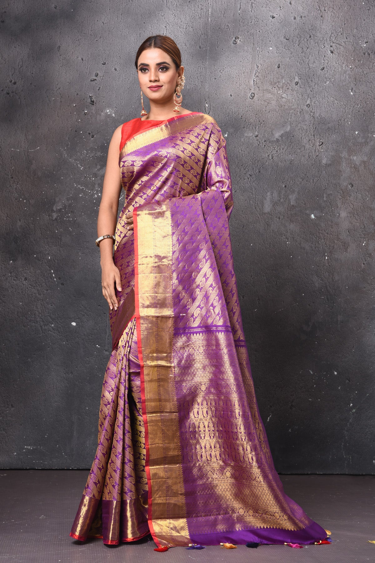Buy beautiful purple handloom Kanjivaram sari online in USA with orange zari border. Keep your ethnic wardrobe up to date with latest designer sarees, pure silk sarees, handwoven sarees, tussar silk sarees, embroidered sarees, Banarasi saris from Pure Elegance Indian saree store in USA.-full view