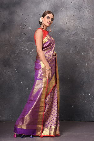 Buy beautiful purple handloom Kanjivaram sari online in USA with orange zari border. Keep your ethnic wardrobe up to date with latest designer sarees, pure silk sarees, handwoven sarees, tussar silk sarees, embroidered sarees, Banarasi saris from Pure Elegance Indian saree store in USA.-side