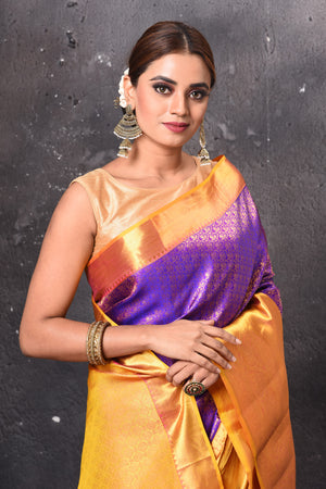 Buy beautiful purple Kanjeevaram silk saree online in USA with yellow zari border. Look elegant on festive occasions in beautiful designer sarees, pure silk sarees, Kanchipuram silk sarees, handloom sarees from Pure Elegance Indian fashion store in USA.-closeup