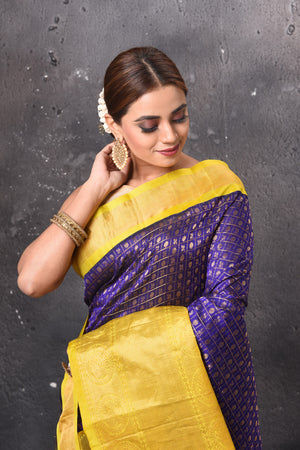 Buy stunning purple zari work Kanjeevaram silk sari online in USA with yellow zari border. Look elegant on festive occasions in beautiful designer sarees, pure silk sarees, Kanchipuram silk sarees, handloom sarees from Pure Elegance Indian fashion store in USA.-closeup