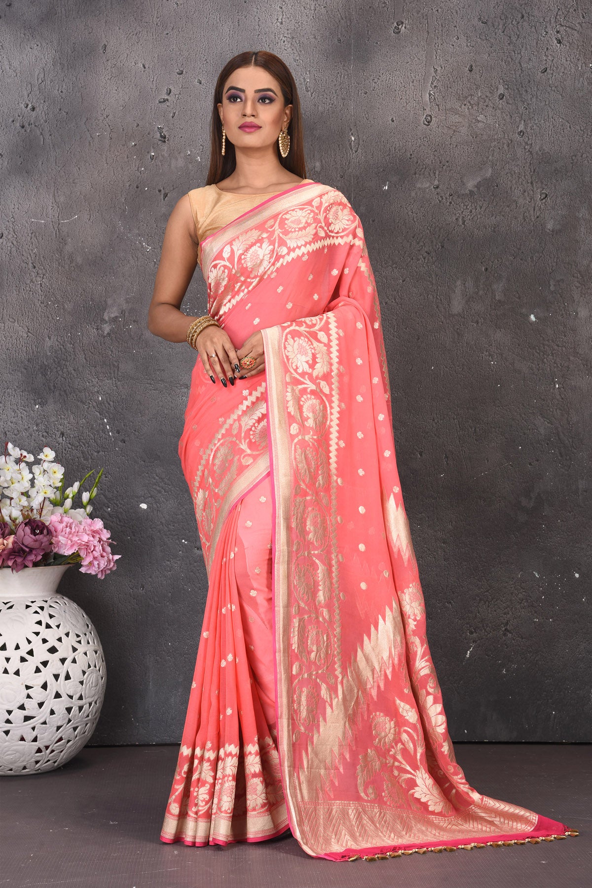 Buy beautiful salmon pink fancy georgette saree online in USA with zari work. Keep your ethnic wardrobe updated with latest designer sarees, pure silk sarees, handwoven sarees, tussar silk sarees, embroidered sarees from Pure Elegance Indian saree store in USA.-full view