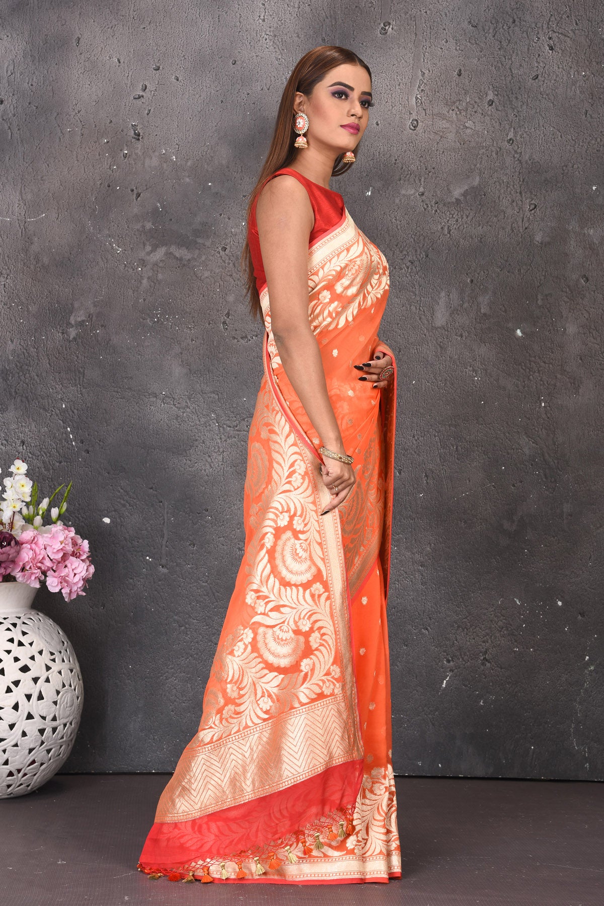 Buy stunning orange fancy georgette saree online in USA with zari work. Keep your ethnic wardrobe updated with latest designer sarees, pure silk sarees, handwoven sarees, tussar silk sarees, embroidered sarees from Pure Elegance Indian saree store in USA.-side