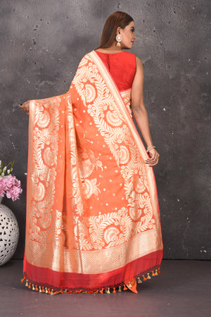 Buy stunning orange fancy georgette saree online in USA with zari work. Keep your ethnic wardrobe updated with latest designer sarees, pure silk sarees, handwoven sarees, tussar silk sarees, embroidered sarees from Pure Elegance Indian saree store in USA.-back