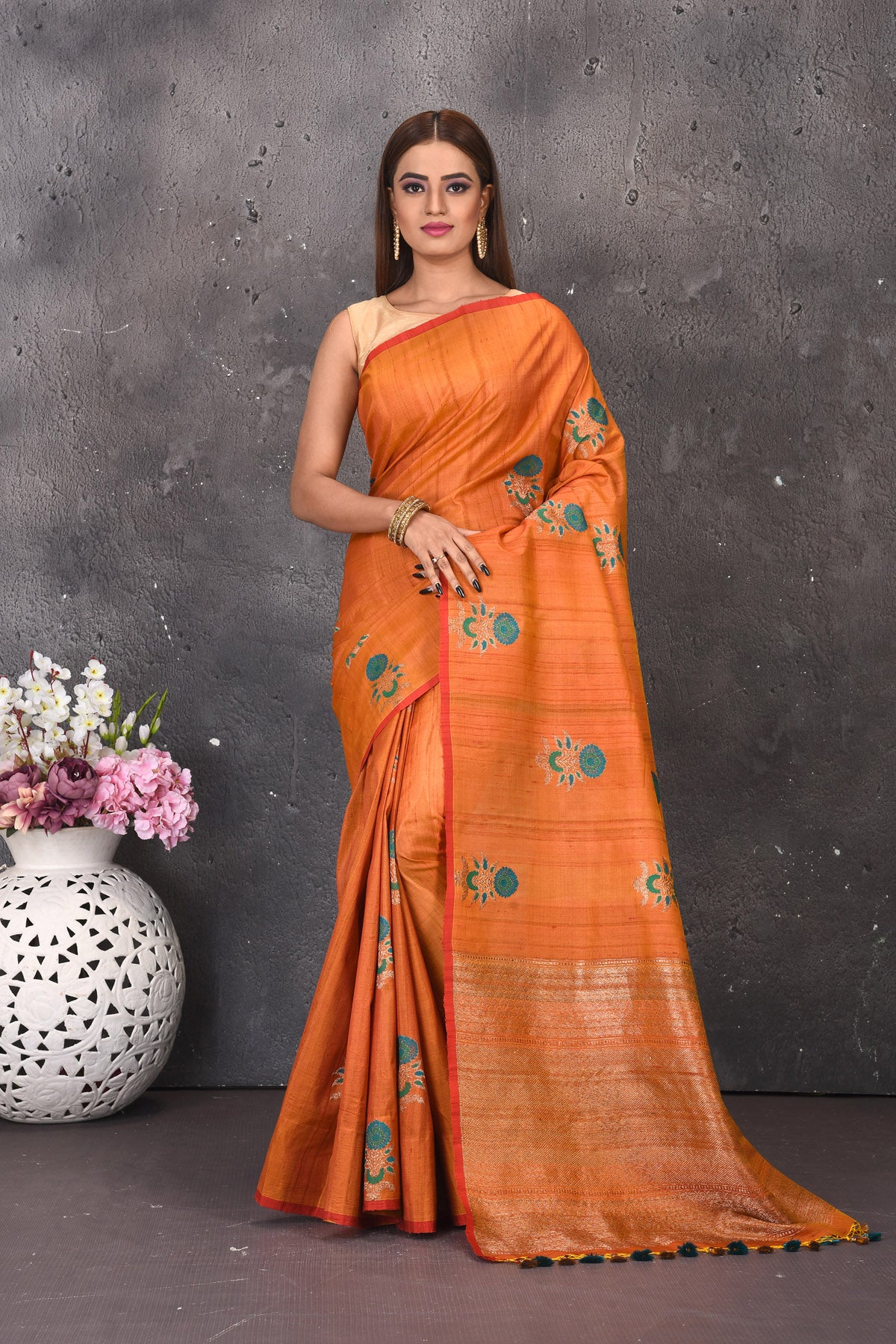 Buy stunning orange tussar silk saree online in USA with antique zari pallu. Keep your ethnic wardrobe updated with latest designer sarees, pure silk sarees, handwoven sarees, tussar silk sarees, embroidered sarees from Pure Elegance Indian saree store in USA.-full view