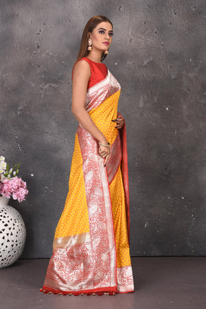 Shop beautiful yellow fancy Katan silk saree online in USA with red zari border. Keep your ethnic wardrobe updated with latest designer sarees, pure silk sarees, handwoven sarees, tussar silk sarees, embroidered sarees from Pure Elegance Indian saree store in USA.-side