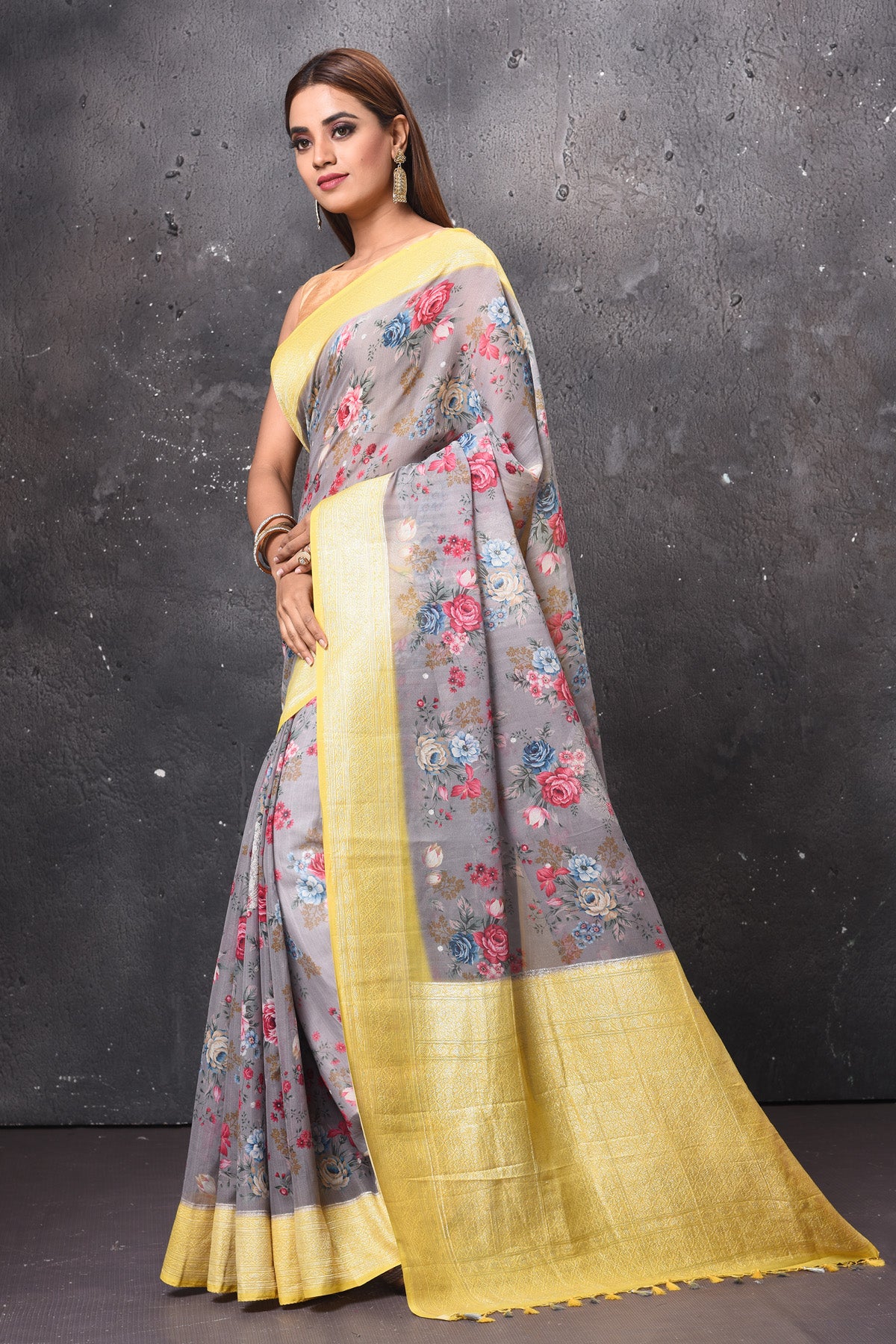 Buy beautiful light grey floral chiffon saree online in USA with yellow zari border. Keep your ethnic wardrobe up to date with latest designer sarees, pure silk sarees, handwoven sarees, tussar silk sarees, embroidered sarees, chiffon saris from Pure Elegance Indian saree store in USA.-pallu