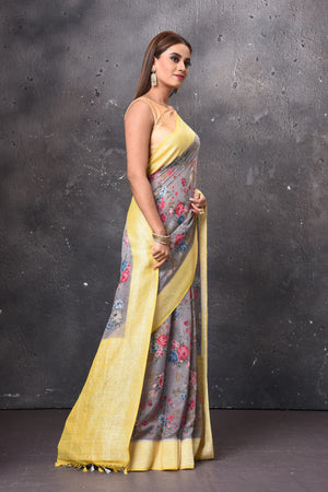 Buy beautiful light grey floral chiffon saree online in USA with yellow zari border. Keep your ethnic wardrobe up to date with latest designer sarees, pure silk sarees, handwoven sarees, tussar silk sarees, embroidered sarees, chiffon saris from Pure Elegance Indian saree store in USA.-right